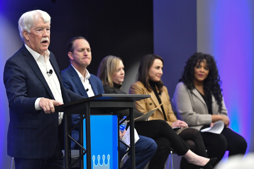 Kansas City Royals' majority owner John Sherman, left, addresses attendants at the third public community meeting Wednesday at the Midwest Genealogy Center to discuss the development of a new ballpark district in or around downtown Kansas City. Members of his advisory board are seated on stage next to him.