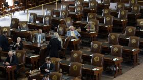 Empty seats are seen in the House Chamber at the Texas Capitol, Tuesday, July 13, 2021, in Austin, Texas. Texas Democrats left the state to block sweeping new election laws, while Republican Gov. Greg Abbott threatened them with arrest the moment they return.