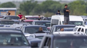 Apr 9, 2020, San Antonio, Texas, USA: People wait Thursday, at Traders Village for the San Antonio Food Bank to begin food distribution. 10,000 people seek San Antonio Food Bank help. The need for emergency food aid has exploded in recent weeks due to the COVID-19 coronavirus epidemic. The Labor Department said Thursday 6.6 million people applied for first time unemployment benefits. (Credit Image: © William Luther/San Antonio Express-News via ZUMA Wire)