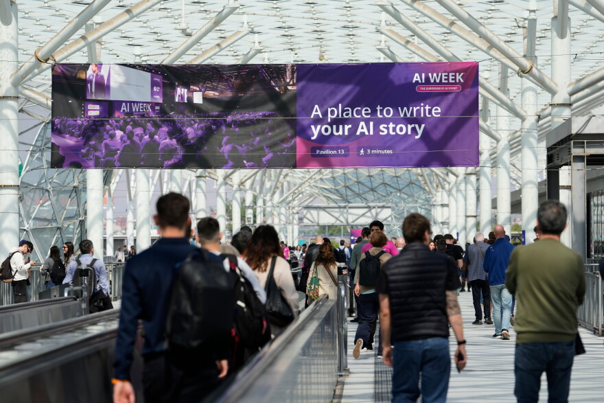 Visitors arrive to the Europe largest artificial intelligence event, AI Week 2026, in Rho, near Milan, Italy, Tuesday, May 19, 2026.