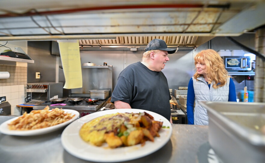 Pennsylvania state Treasurer Stacy Garrity, the Republican candidate for governor, speaks to a cook at Tammy's Kitchen in Luzerne on the first stop of her 'Turnaround PA' tour.