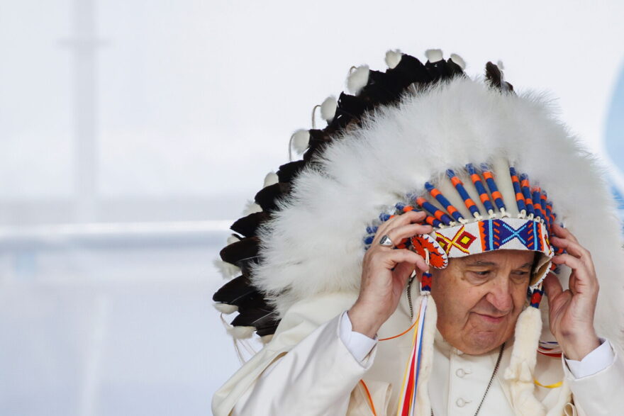Pope Francis wears a traditional headdress that was gifted to him by indigenous leaders during his visit in Maskwacis, Canada.