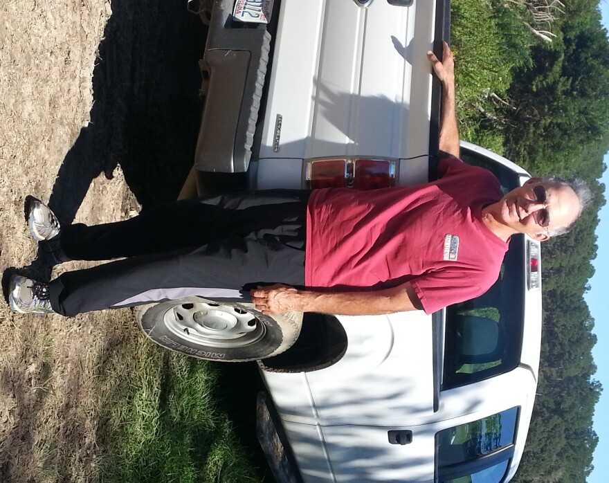 Kelly Holden stands in front of his truck a few days after rain and flood waters damaged some of the fruit and vegetable crops on his 250 acres of land. His family has been farming in Brunwisck County since the 1750s.