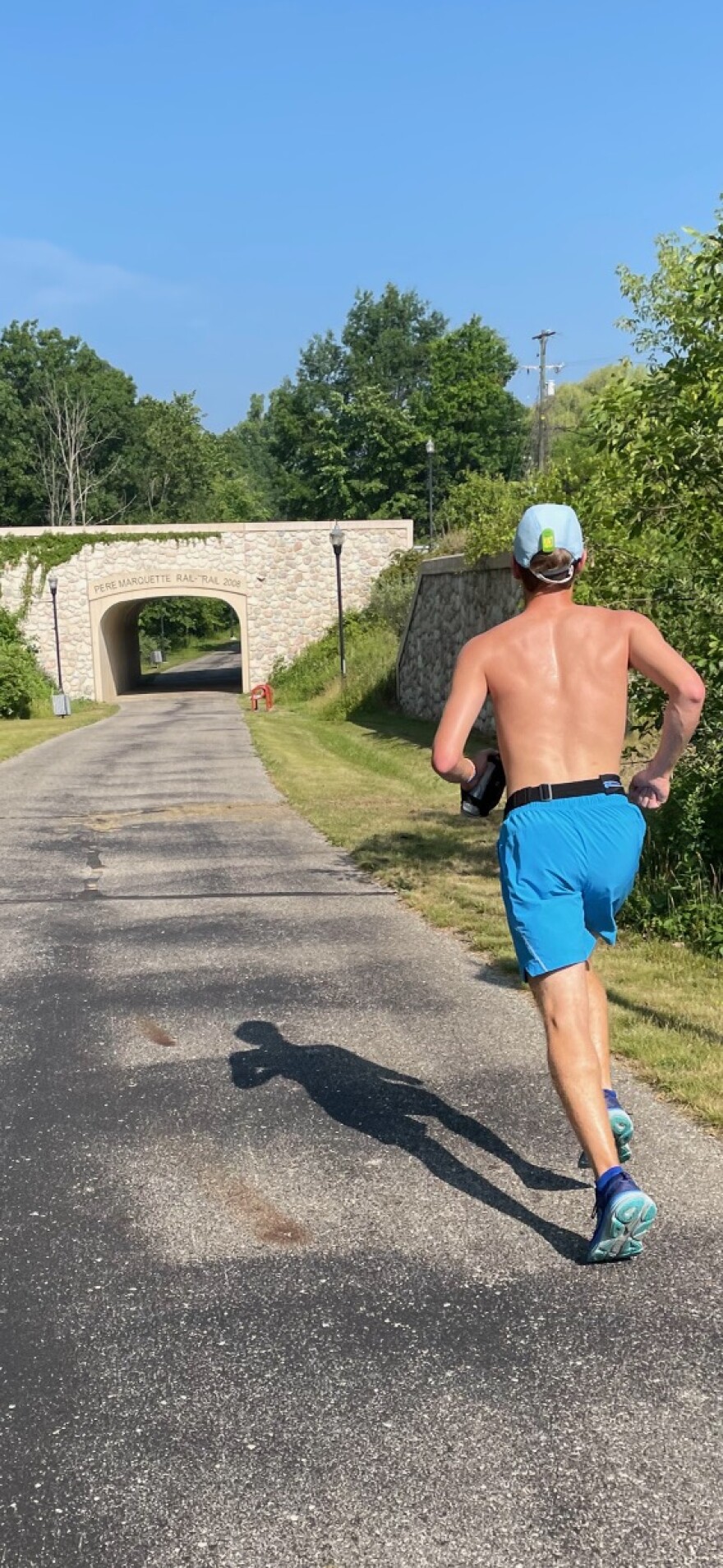 Matthew Pattullo running on Pere Marquette Rail Trail