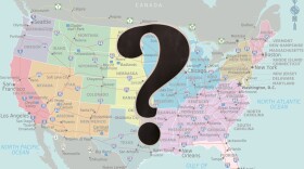 Colorful map of the USA with a black question mark in the foreground 