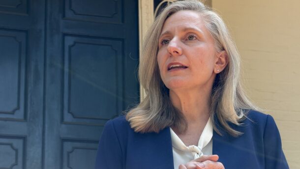 Virginia Gov. Abigail Spanberger stands outside the Executive Mansion in Richmond as her administration faces growing tensions with some fellow Democrats over a series of high-profile vetoes and amendments to major legislation.