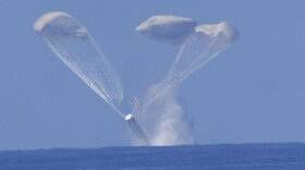 The space shuttle twin solid rocket boosters separate from the orbiter and land in the ocean, where they are collected for reuse by NASA.