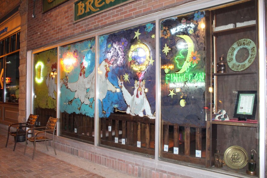 Painting of chickens on a bar window