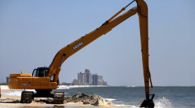 Workers clean oil leftover from the Deepwater Horizon oil spill in the Gulf of Mexico in Pensacola, Florida last month. Wednesday marks the one-year anniversary of the BP oil spill.