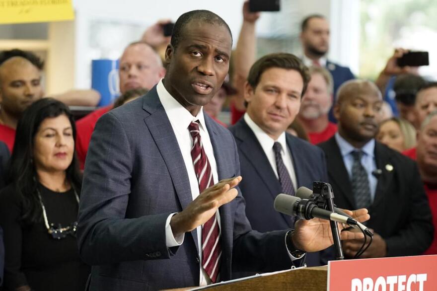 In this file photo, Florida Surgeon General Dr. Joseph Ladapo gestures as speaks to supporters and members of the media before a bill signing by Gov. Ron DeSantis on Nov. 18, 2021, in Brandon, Fla.