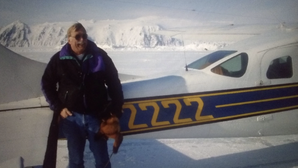 Ken Jouppi stands next to the Cessna 206 that the state of Alaska later seized after he was convicted on a bootlegging charge for ignoring beer loaded onto a flight en route to the dry village of Beaver in 2012.