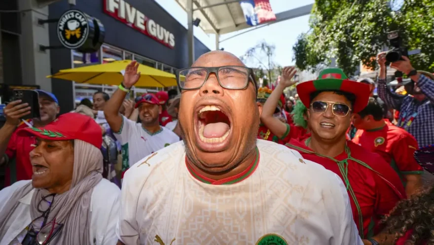 Morocco native Hamid Ghiouan leads a crowd of fans in chants before the FIFA World Cup Quarterfinal game between Morocco and France on Thursday, July 9 at Patriot Place in Foxborough, Mass.