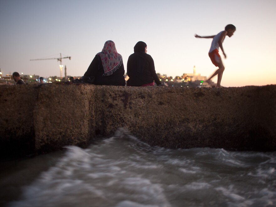 Palestinians enjoy a day at a beach last week. Many West Bank Palestinians allowed into Israel in recent weeks headed to the Mediterranean shore.