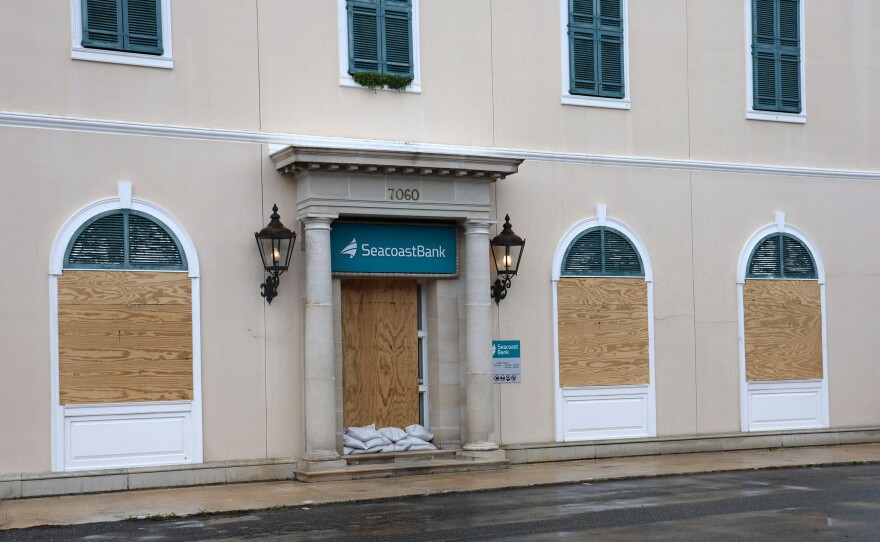 Store windows are boarded in Cedar Key in preparation for Hurricane Helene which is expected to make landfall as a Category 3 hurricane Thursday evening. (Azhalia Pottinger/WUFT News)