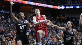 Indiana Fever guard Caitlin Clark (22) is goes to the basket as Connecticut Sun forward Olivia Nelson-Ododa (10) and guard Veronica Burton (22) defend during the first half in Game 2 of a first-round WNBA basketball playoff series, Wednesday, Sept. 25, 2024, in Uncasville, Conn. (AP Photo/Jessica Hill)