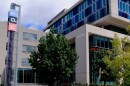 This is a picture of the NPR headquarters building in Washington, D.C. On the left side of the image is a large "NPR" sign. 
