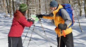 Kate Wanner, project manager with the Trust for Public Land, checks a map of the Proctor Village Forest with Wayne Flewelling, a volunteer with the Catamount Trail Association.