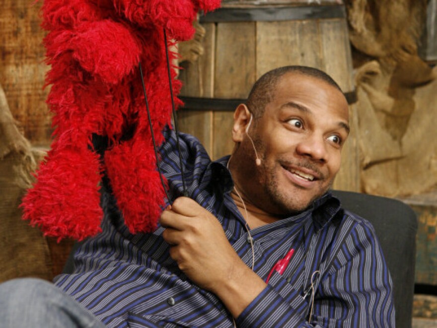 Elmo and Clash, on the <em>Sesame Street</em> set in 2006.