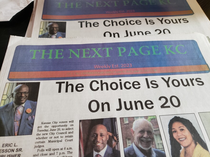 Photo of the a new newspaper with city council candidates images ahead of the June election.