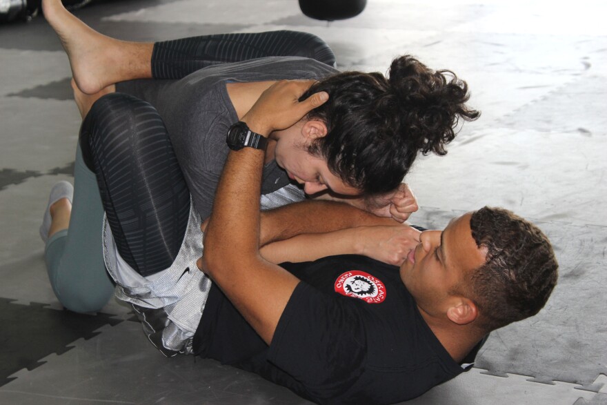 Students practice Brazilian Jiu-Jitsu moves under a six-week self-defense course by nonprofit End Rape Culture.