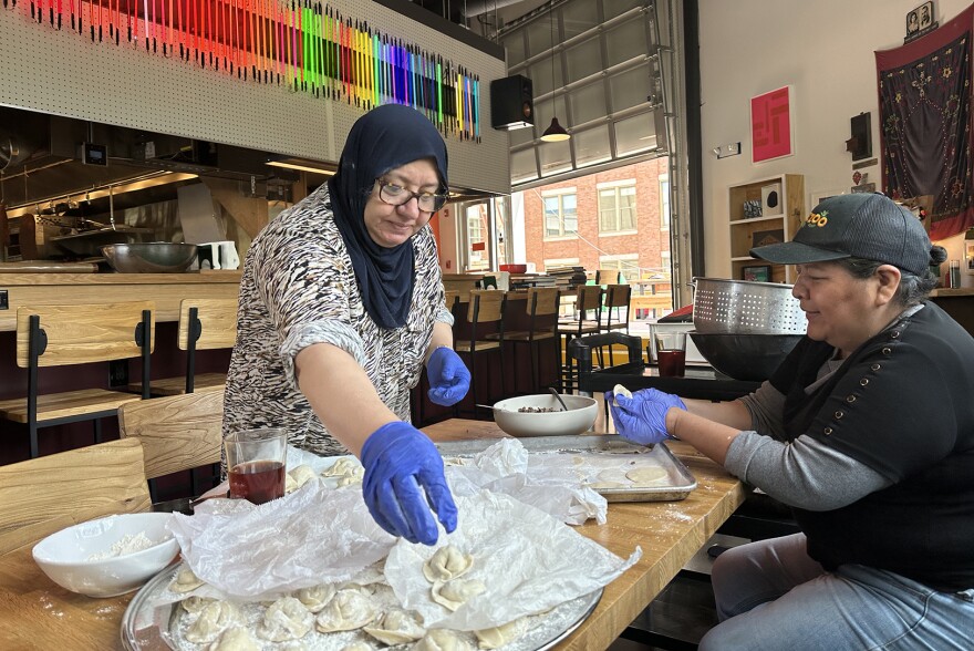 Members of the Nour’s team prepare Lebanese cuisine from the new restaurant’s menu.