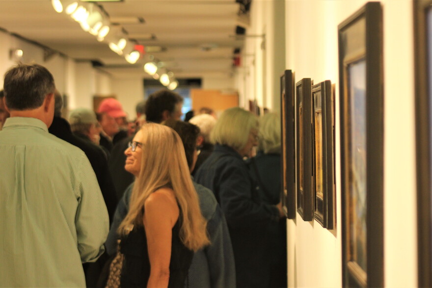 Artists and community members gather for the opening of the "Where We Live" art show at the Red Brick Center for the Arts on Sept. 22. The show features landscapes of the Roaring Fork Valley by six local artists.