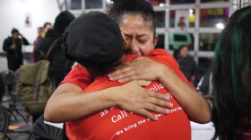 Sylvia Gonzales hugs a friend after President Obama's immigration announcement