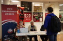 At a voter registration drive at Keene State College, staff from the city clerk's office help students register to vote and answer questions.