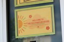 A sign at Tandem says "Welcome to the Postpartum House."