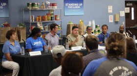 From left to right: St. Louis Area Foodbank CEO Meredith Knopp, SNAP recipient Mauriel White, First Assistant Deputy Governor for Health and Human Services Ryan Croke, Illinois Gov. JB Pritzker, Illinois Department of Human Services Sec. Dulce Quintero, Illinois Retail Merchants Association President and CEO Rob Karr and Lessie Bates David Neighborhood House CEO Rev. Gary Gatson discuss cuts to SNAP at a roundtable discussion in East St. Louis on Tuesday.