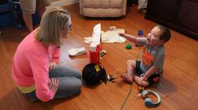 Matthew Gable, right, plays with his mom in their Ormond Beach home.