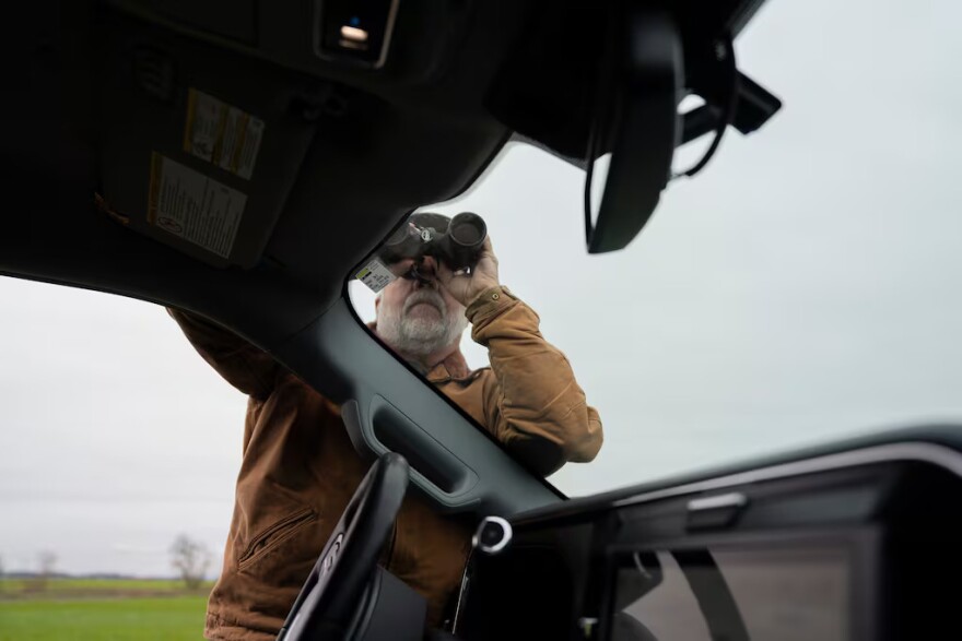 Troy Jones looks for bald eagles out on his family's land near the proposed solar site in Harrisburg, Ore. on March 6, 2026. Jones, an avid hunter and fisherman, has been leading Friends of Gap Road, the local group opposed to the solar project.