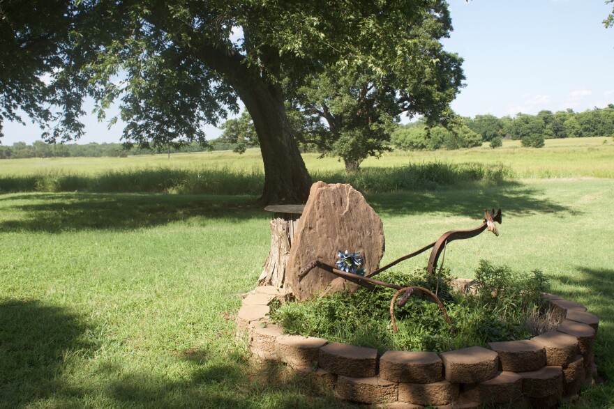 "Heritage Rock" sits along the Raineys' driveway. It's a memorial — Linda Rainey's family members once stepped over the stone on the pathway into their yard when they occupied the Guthrie farm decades ago.