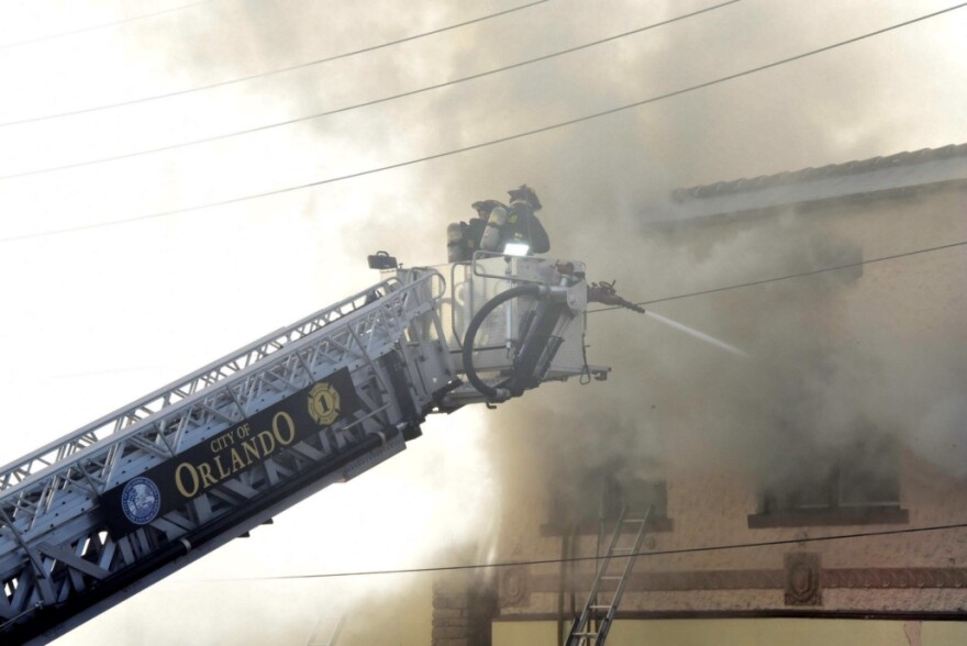 Orlando firefighters work to extinguish a building fire.