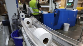 Toilet paper moves out from a cutting machine at the Tissue Plus factory in Bangor, Maine. (Robert F. Bukaty/AP)