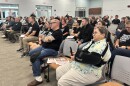 Community members and parents attend an Oldham County School Board meeting on whether to allow Bible-based moral education group Lifewise to operate within the district.
