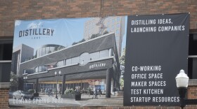 A banner advertising Distillery Labs hangs on the future physical site of the innovation space at 201 SW Adams, the former ICC Thomas building.