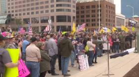 Protesters lined most of the wide sidewalk in front of the Indiana Statehouse. (Lauren Chapman/IPB News)