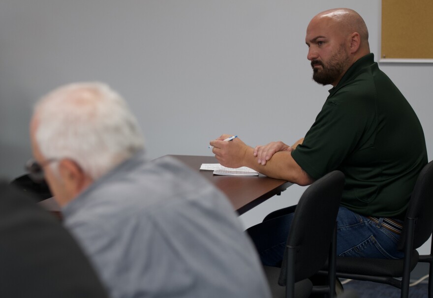Chris Belles looks toward Walter Griffith. Belles challenged the validity of signatures on Griffith's petition for referendum on Luzerne County's non-discrimination ordinance.