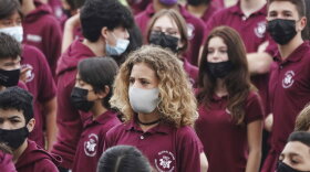 Students at Ruth K. Broad Bay Harbor K-8 Center in Bay Harbor Islands, Fla., wear face masks during a Miami Heat event, Thursday, Aug. 26, 2021. Miami-Dade schools, the nation’s fourth-largest district with 340,000 students, began classes Monday with a strict mask mandate. (Joe Cavaretta/South Florida Sun-Sentinel via AP)