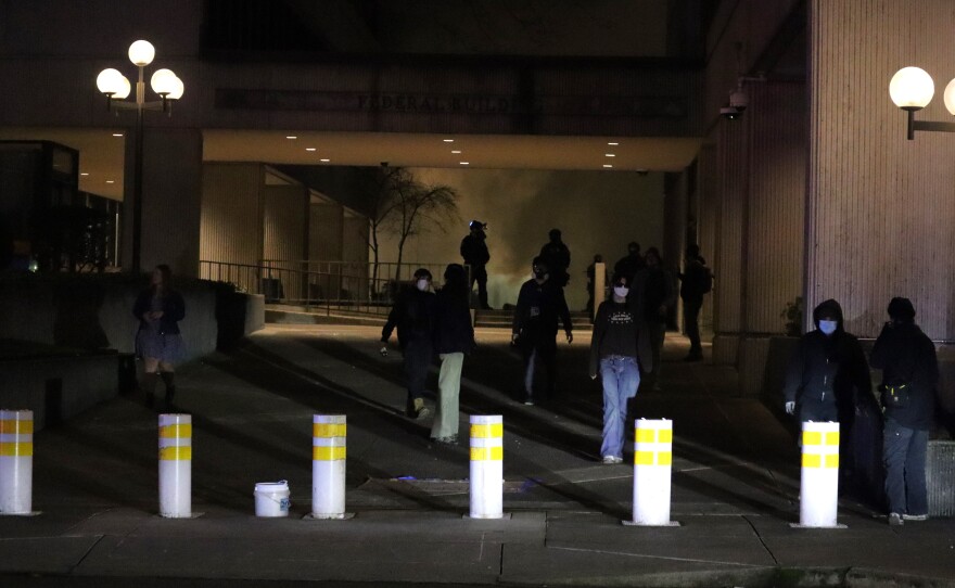 Law enforcement deploy tear gas at the Eugene Federal Building, Jan. 30, 2026.