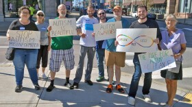 Brandon Lux, second from right, organized a protest on Sunday in Scranton against what he called autism misinformation from the Trump administration.