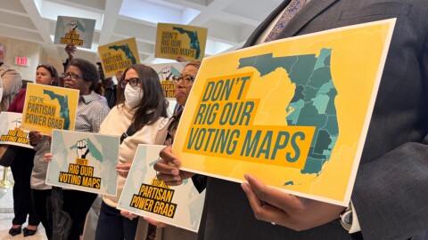 Opponents of mid-decade efforts to redraw congressional voting districts gather to protest in the Florida Capitol in Tallahassee, Fla., Dec. 2, 2025. 