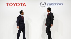 Toyota Motor Corp. President Akio Toyoda, left, and Mazda Motor Corp. President Masamichi Kogai. The rivals will build a joint manufacturing plant in Alabama. 