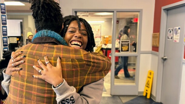 Trini Badian, 23, of Manchester, was homeless most of her life before she connected with Waypoint and used its drop-in center and free subsidized housing to afford her own apartment. She hugs a friend at Waypoint's Manchester drop-in center.