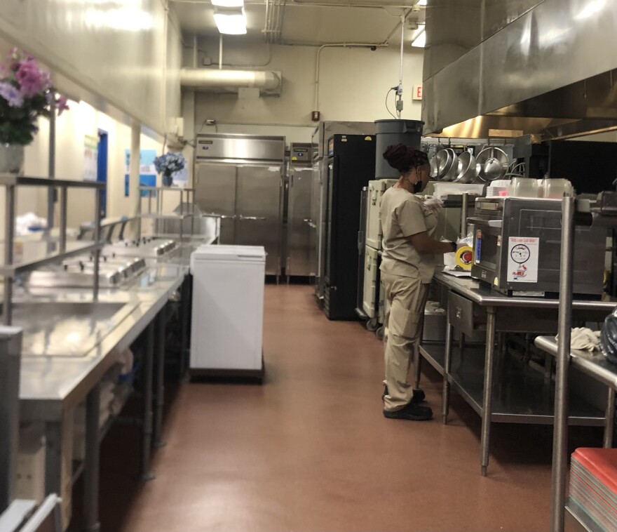 Takeyla Strickland works in the school cafeteria kitchen at Edison K-8 Center in Miami. Starting in the fall, many schools across the country will once again have to charge students to eat school meals.