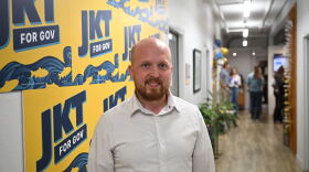 Jonathan Kreiss-Tomkins poses at his primary election night party the The Rail in Anchorage on Aug. 18, 2026.
