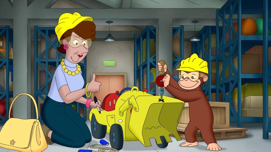 Curious George repairing a tractor