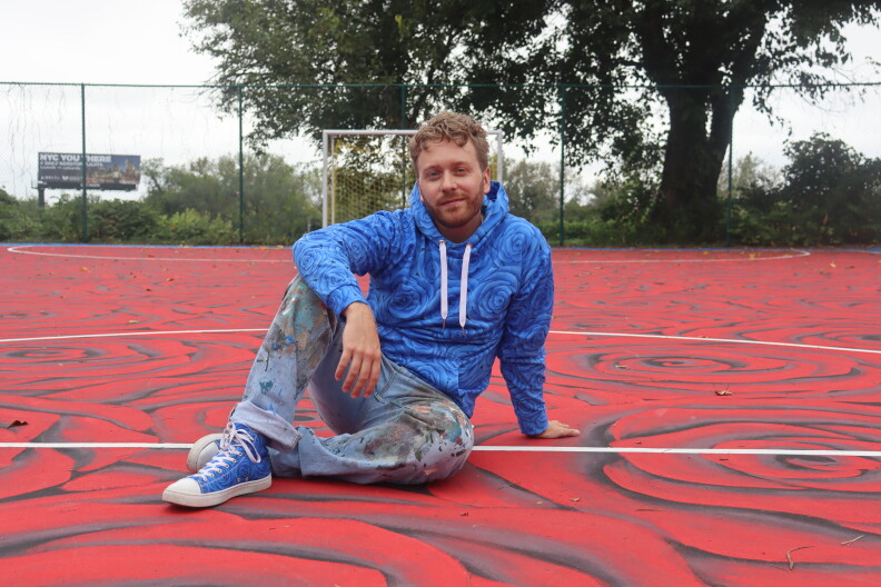 Kentucky muralist paints Louisville sport court with a bed of roses