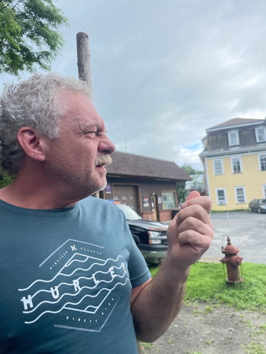 A man from the side, squinting